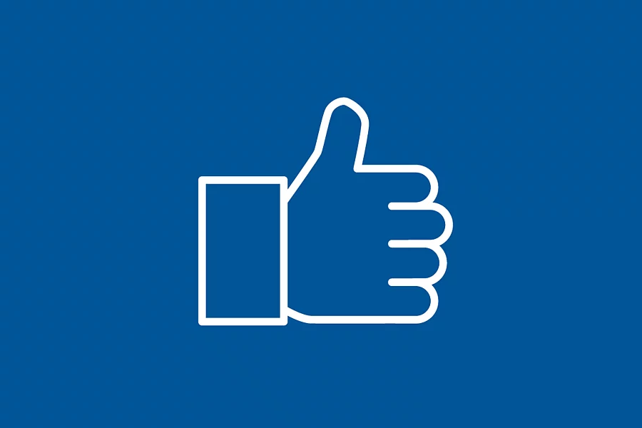 A white icon with a thumbs-up on a blue background